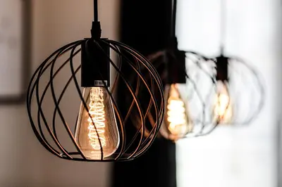 two pendant lights are hanging in a room at Schöne Wohnung im Herzen von Herisau bis 6 Gäste in Herisau