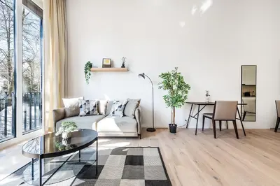 a living room with a couch and a table at DESIGN-STUDIO 2 !Gratis Parken, Free Parking! in Kreuzlingen