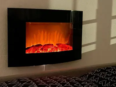 a fire in a fireplace in a wall at Appartement Hörnli Seeliebe in Kreuzlingen