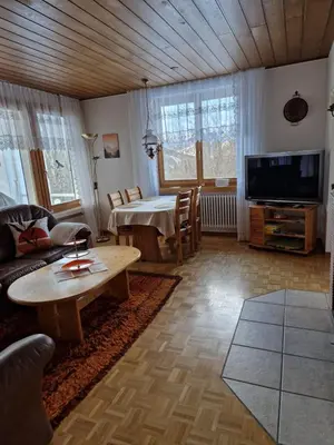 a living room with a couch and a table at Chalet Thur in Unterwasser
