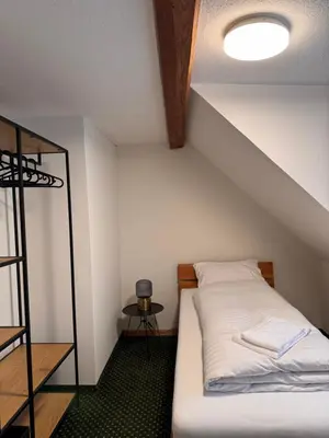a bed in a room with a ceiling at Schiff Kesswil in Kesswil