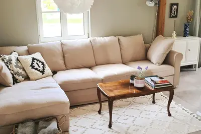 a living room with a couch and a coffee table at Kaffeegasse 11 - Holiday home with heart on Lake Constance in Altnau