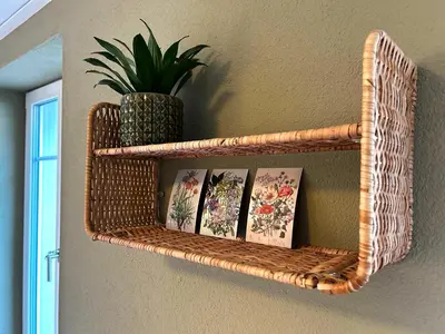 a wicker shelf on a wall with books at Klara 0002 - Olma, Spital, Uni St- Gallen in St. Gallen