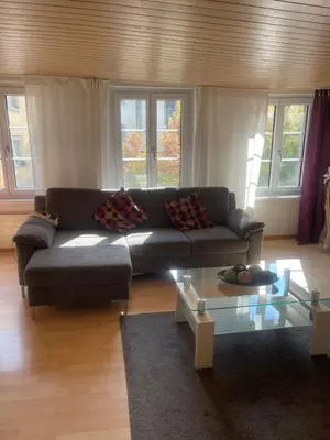 a living room with a couch and a coffee table at Como apartamento en el centro de st Gallen in St. Gallen