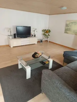 a living room with a couch and a coffee table at Como apartamento en el centro de st Gallen in St. Gallen