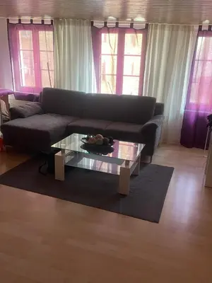 a living room with a couch and a glass table at Como apartamento en el centro de st Gallen in St. Gallen