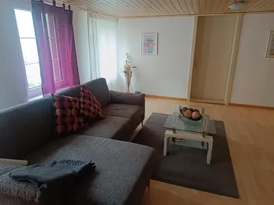 a living room with a couch and a table at Como apartamento en el centro de st Gallen in St. Gallen