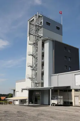 a large white building with a fire escape at Towerhotel in Waldkirch