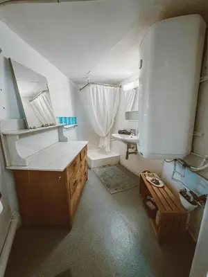 a kitchen with a sink and a counter in a room at Central city apartment with terrace in St. Gallen