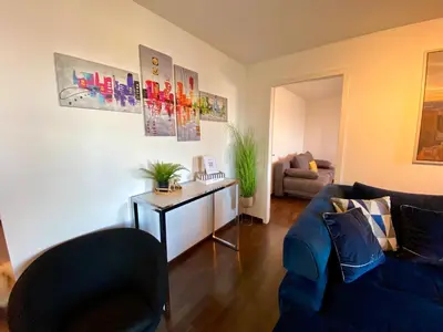 a living room with two couches and a couch at Modern Lakeview Apartment in Romanshorn