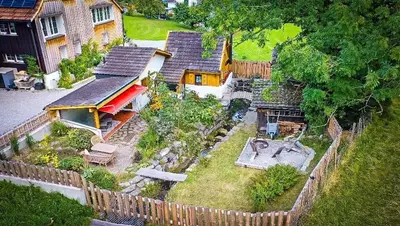 an aerial view of a house with a fence at Zum Wöschhüsli mit Sauna in Rheineck