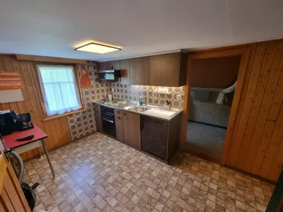 a kitchen with a sink and a counter top at Ferienwohnung Toggilodge in Unterwasser