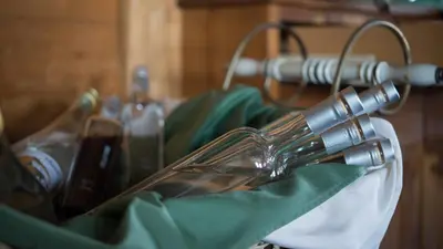 a close up of a wine glass on a rack at Hotel Badhof in Altstätten