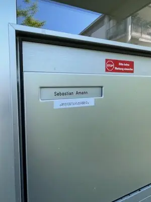 a white door with a sign on top of it at DESIGN-APARTMENT 2 !Gratis parken, Free Parking! in Kreuzlingen