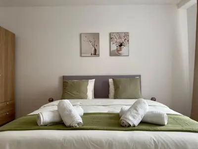 a living room with a couch and a table at Modern Apartment St Gallen Zentrum in St. Gallen