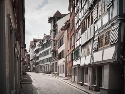 an empty street in a city with buildings at normalkonsum - premium apartments in St. Gallen