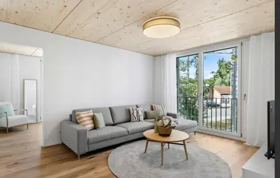 a kitchen with white walls and a table and chairs at Lake & Parkside - Ihr unvergesslicher Bodensee-Aufenthalt in Salmsach