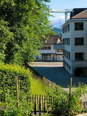 a view of a building with a fence and trees at Charmantes Studio in Teufen in Teufen