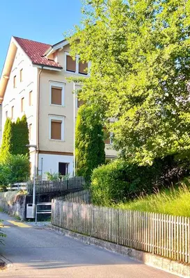 a house with a fence in front of a house at Charmantes Studio in Teufen in Teufen