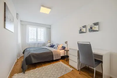 a bedroom with a bed and a desk and a chair at Zimmer mit Gemeinschaftsbad in Arbon