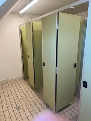 a row of green lockers in a bathroom at Mattenhof in Flawil