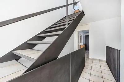 a concrete staircase in a house with a white wall at CITY HOUSE !Gratis Parken, Free Parking! in Kreuzlingen