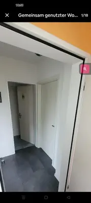 an empty room with a door and a hallway at Zimmer oberhalb einer Schokoladenfabrik in Kreuzlingen