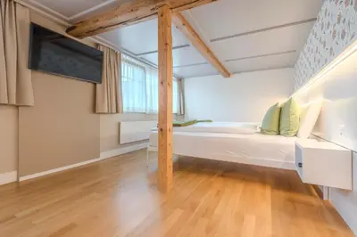 a room with a bed and a window at Gasthaus zur Sonne - Hotel - Restaurant - Boutique in Gossau