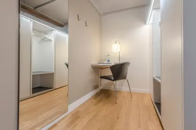 a room with a desk and a chair in a room at Gasthaus zur Sonne - Hotel - Restaurant - Boutique in Gossau
