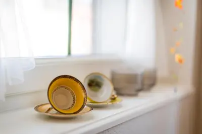 two cups sitting on a counter next to a window at Gasthaus zur Sonne - Hotel - Restaurant - Boutique in Gossau