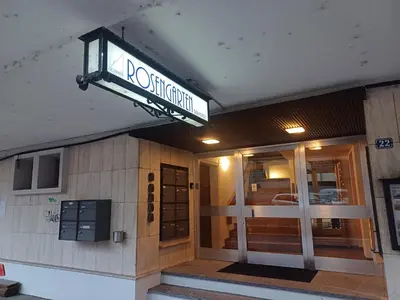 a building with a sign on the front of it at Studio Marylin in Rorschach