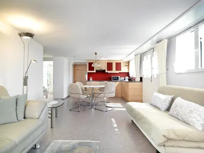 a living room with a couch and a table at Hotel B&BAlpenheim in Teufen