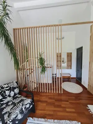 a living room with a couch and a table at Maisonette-Wohnung inmitten der Natur in Wald