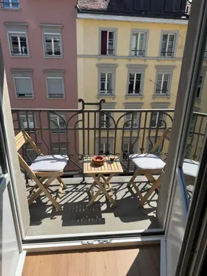 a view of a balcony with a table and chairs at Studio mit Balkon im Zentrum in St. Gallen