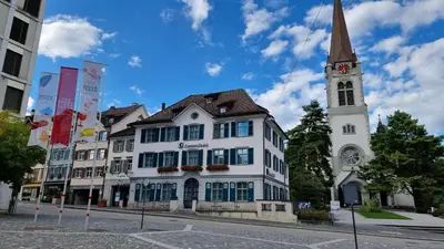 a white building with a steeple and a church at Eigenen Unterkunft I Vierländereck I Natur I St Gallen in Rebstein