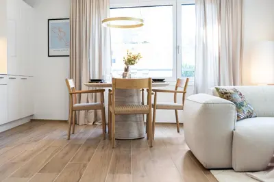 a living room with a table and a couch at BLIV Design-Apartment mit Parkplatz, nahe Zentrum in St. Gallen