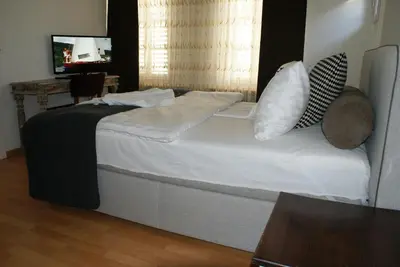 a small room with a bed and a staircase at Kränzlin Hotel in St. Gallen