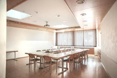 a large conference room with a long table and chairs at Hotel und Restaurant Wolfensberg in Degersheim