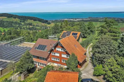 an overhead view of a house with orange roofs at romatisches Chalet mit Bodenseesicht in Wolfhalden