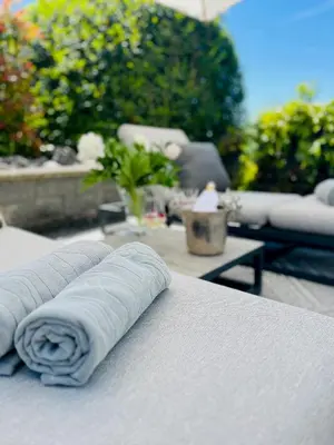 a swimming pool in a house with a white ceiling at Suite4you Erlen l Privater Pool ganzjährig beheizt & Sauna l 10min zum Bodensee, Parkplatz & WLAN in Erlen