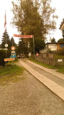 a street sign on the side of a road at SwissCottages Blockhaus in Schönengrund