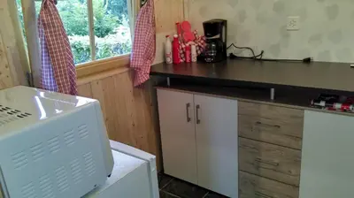 a kitchen with a counter and a counter top at SwissCottages Blockhaus in Schönengrund