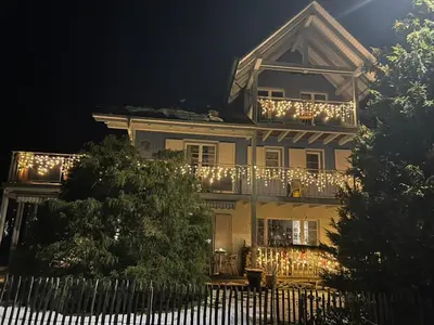 a balcony with a view of a green field at Apartment with charm and dream view in Hosenruck