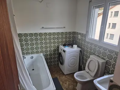 a bathroom with a toilet and a sink at SwissRest - Self Check-In in Sevelen