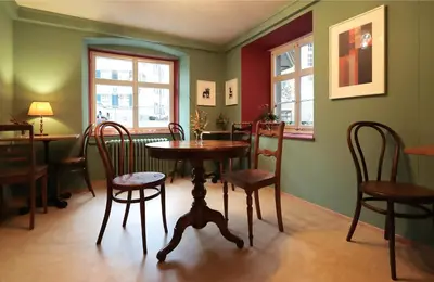 a dining room with a table and chairs at Krone Trogen in Trogen
