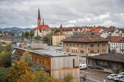 a view of a city with buildings and a church at Modernes Hostel, Privatzimmer in Shared Apartment, WYBA Living in St. Gallen