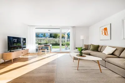 a living room with a couch and a table at DESIGN-APARTMENT 1 !Gratis parken, Free Parking! in Kreuzlingen