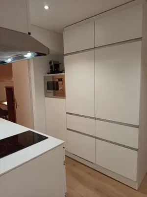 a kitchen with white cabinets and a stove at Gästehaus Rossfall 424 - Self-Check-in in Urnäsch