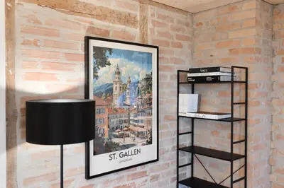 a picture of st galliard on a wall with a lamp at BLIV Grosszügiges Altbaujuwel im Zentrum in St. Gallen