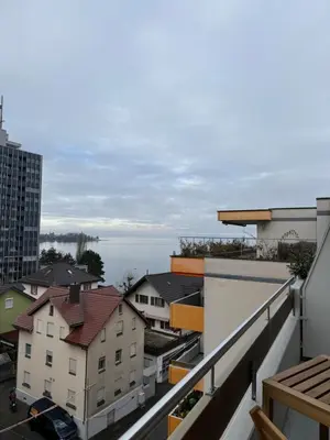 a view of a city from a balcony at HRE Apartments Lago Rorschach in Rorschach